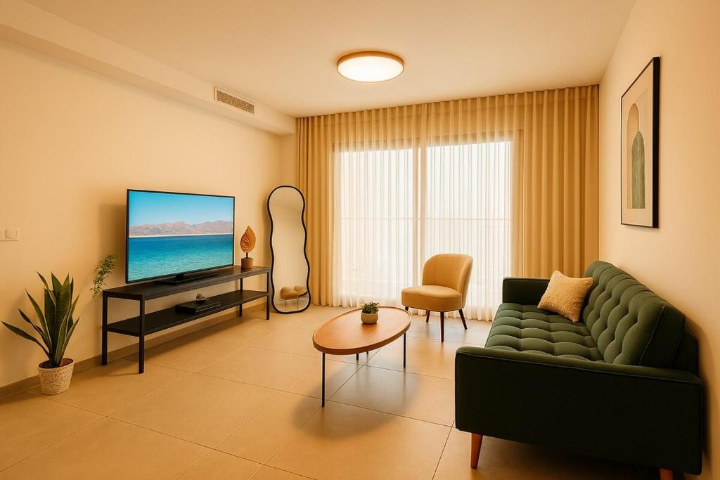 Телевизор и/или развлекательный центр в oasis apartment