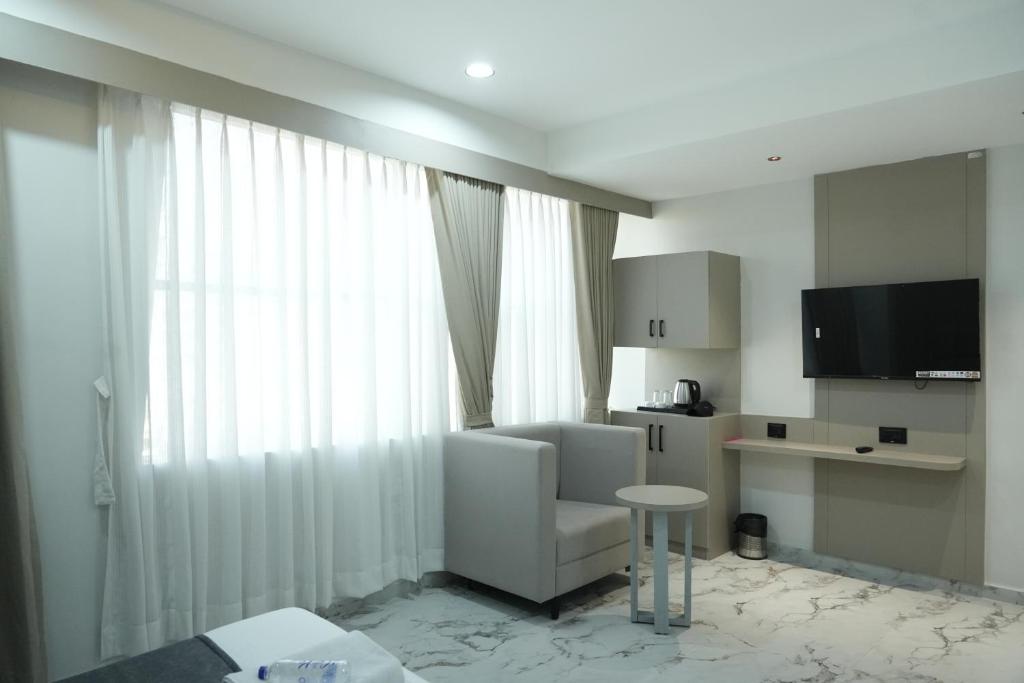 TV a/nebo společenská místnost v ubytování Hotel M Town