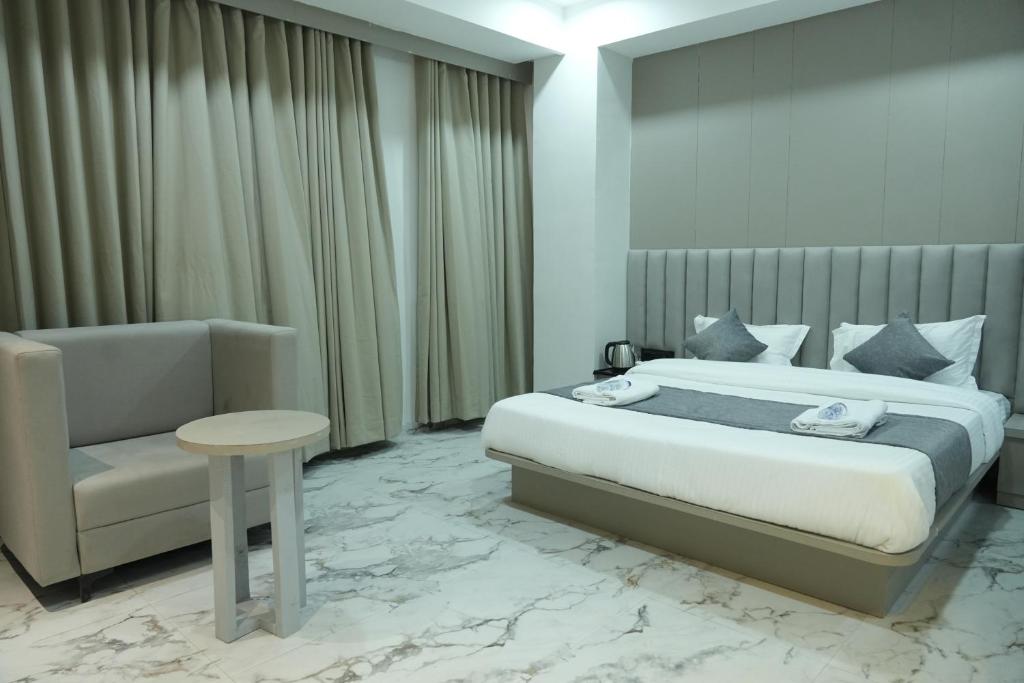 Postel nebo postele na pokoji v ubytování Hotel M Town