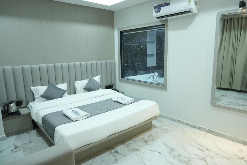 Postel nebo postele na pokoji v ubytování Hotel M Town