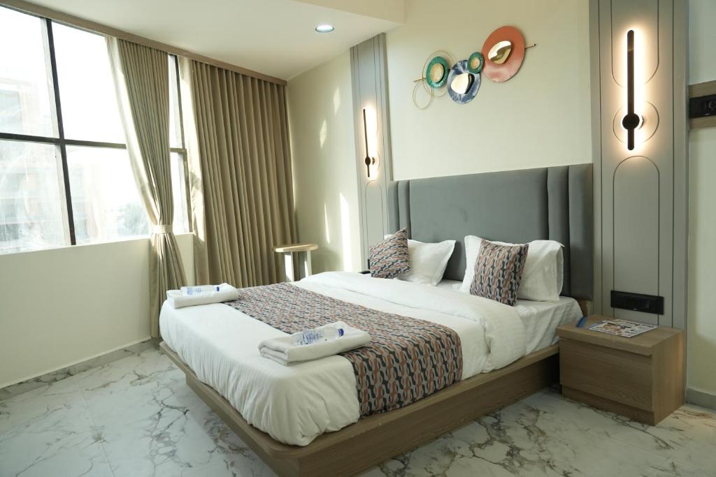 Postel nebo postele na pokoji v ubytování Hotel M Town