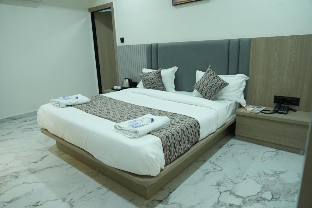 Postel nebo postele na pokoji v ubytování Hotel M Town