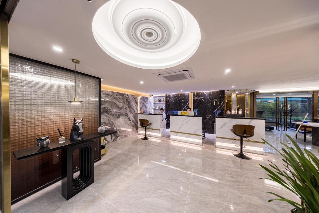 Vstupní hala nebo recepce v ubytování 颐程City View Hotel-广州太古汇珠江新城体育中心石牌桥地铁站店-广交会专享