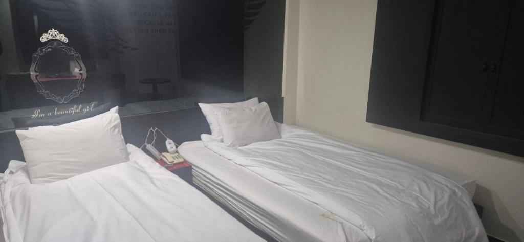 Postel nebo postele na pokoji v ubytování Yeoju Picnic Motel