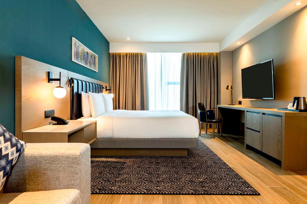 Letto o letti in una camera di Hyatt Place Nairobi Westlands