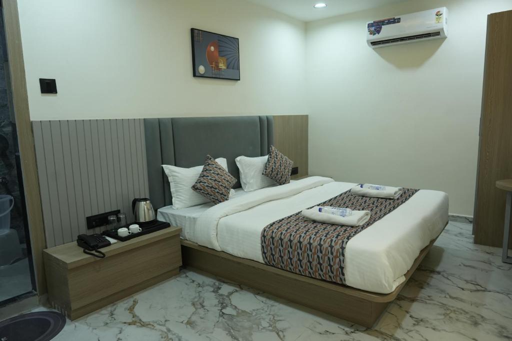 Postel nebo postele na pokoji v ubytování Hotel M Town