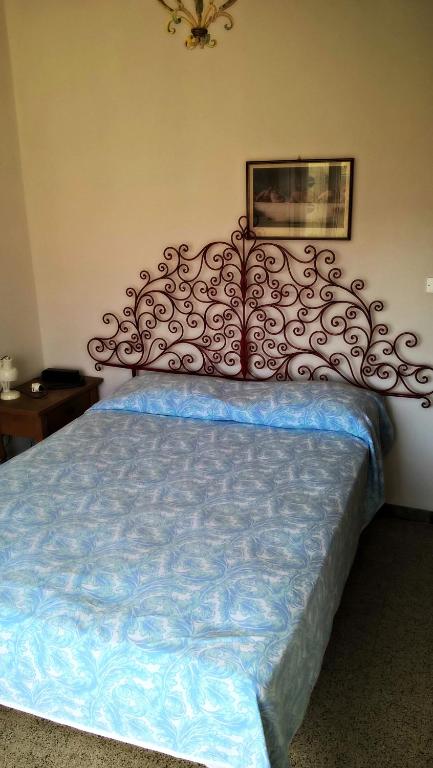 Postel nebo postele na pokoji v ubytování Hotel Villa Furia