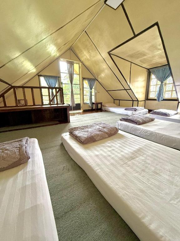 Postel nebo postele na pokoji v ubytování LY Lodge