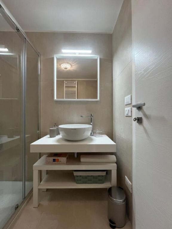 a bathroom with a sink and a shower at Casa Vacanze 'La Quercia' in Cisternino