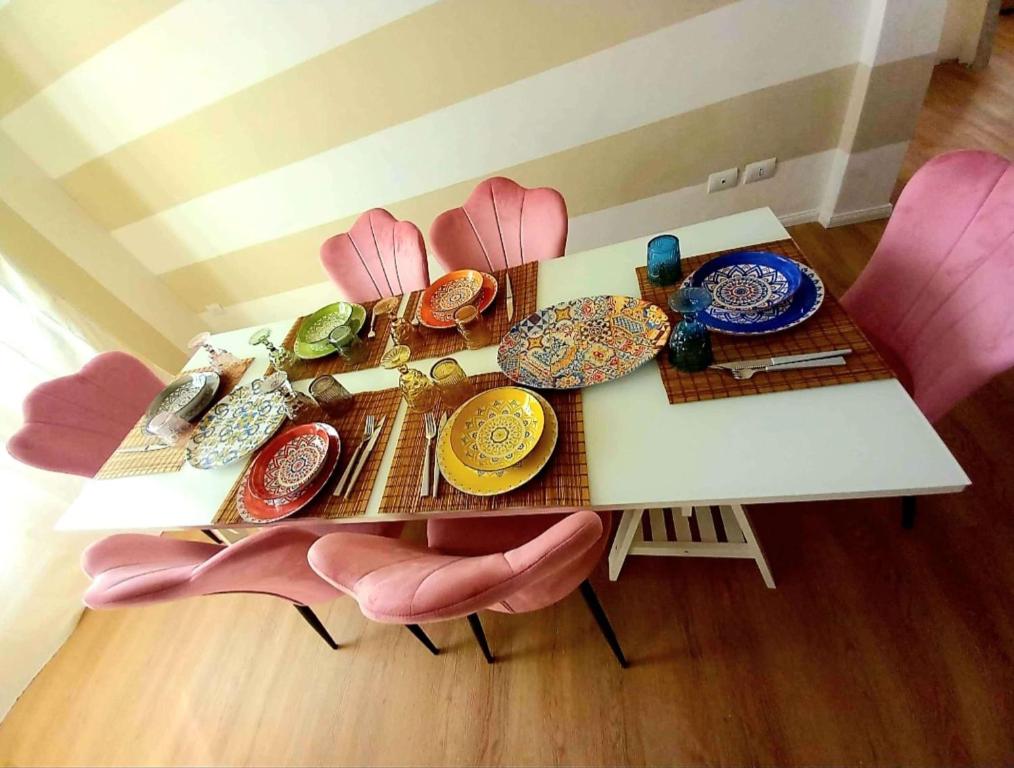 a table with plates and dishes on top of it at Terzopiano in Pisa