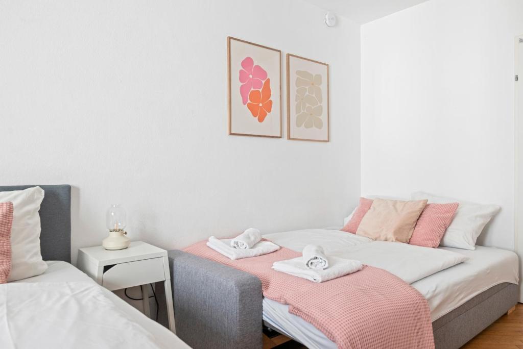 Posteľ alebo postele v izbe v ubytovaní 2 BR City Apartment in Neubau, 6 min to city center