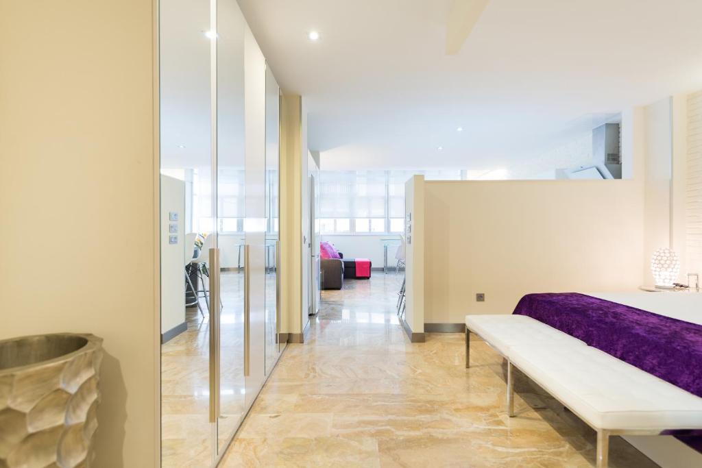 Postel nebo postele na pokoji v ubytování Suites Garden Loft Picasso