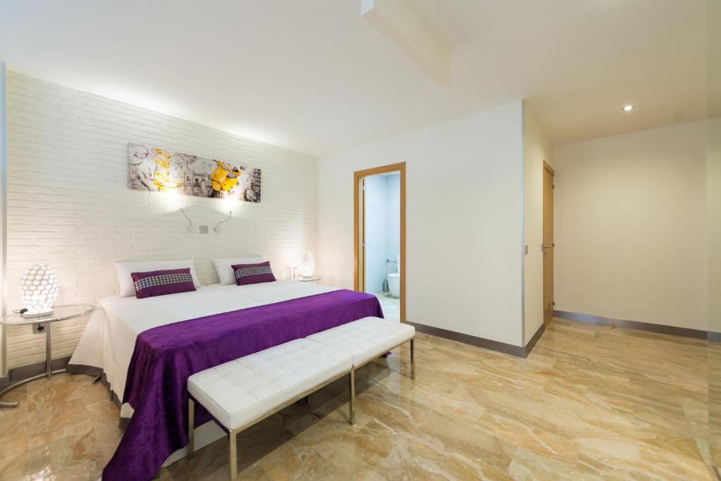 Postel nebo postele na pokoji v ubytování Suites Garden Loft Picasso