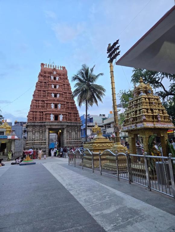 two temples in a city with a fence at Temple View in Bangalore