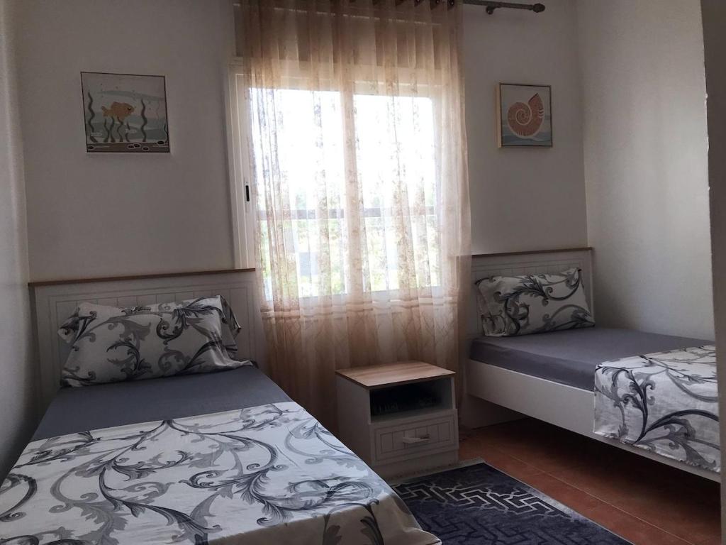 Postel nebo postele na pokoji v ubytování Fnideq Superbe appartement