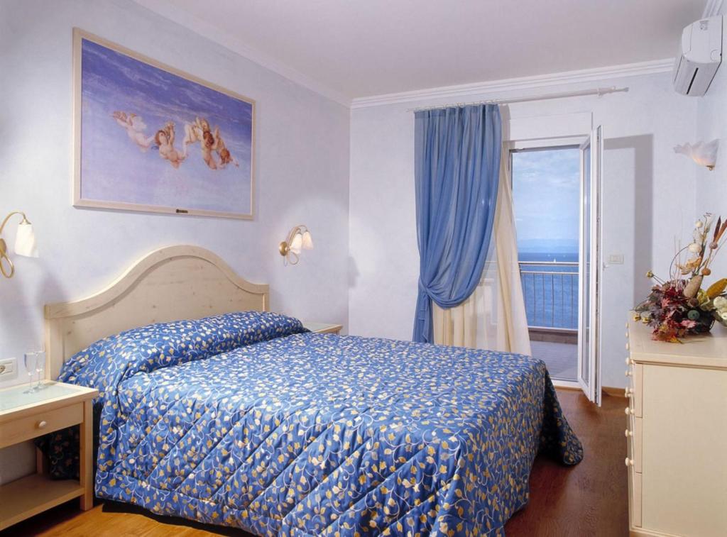 Postel nebo postele na pokoji v ubytování Skiper Apartments & Golf Resort