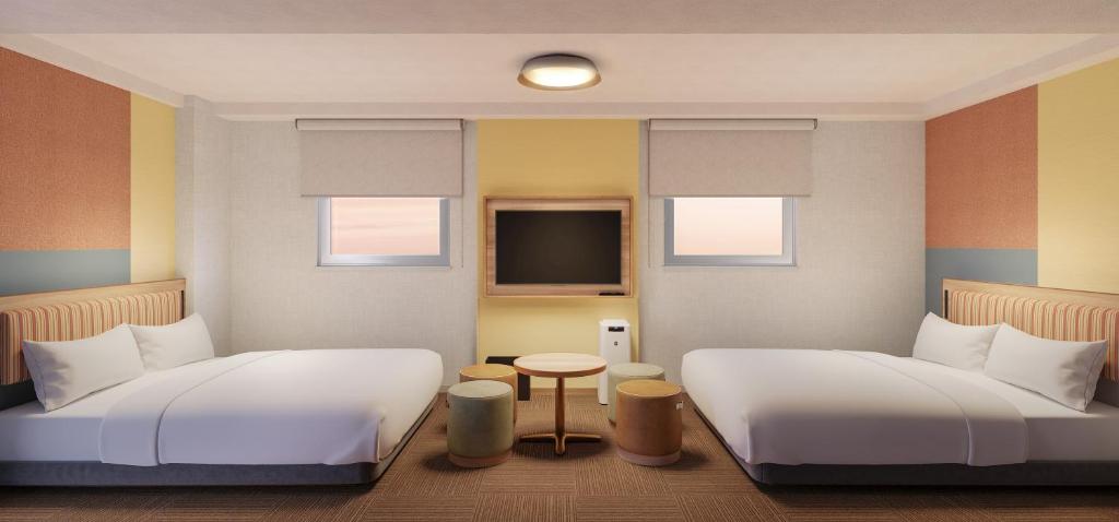 Postel nebo postele na pokoji v ubytování CVS Bay Hotel