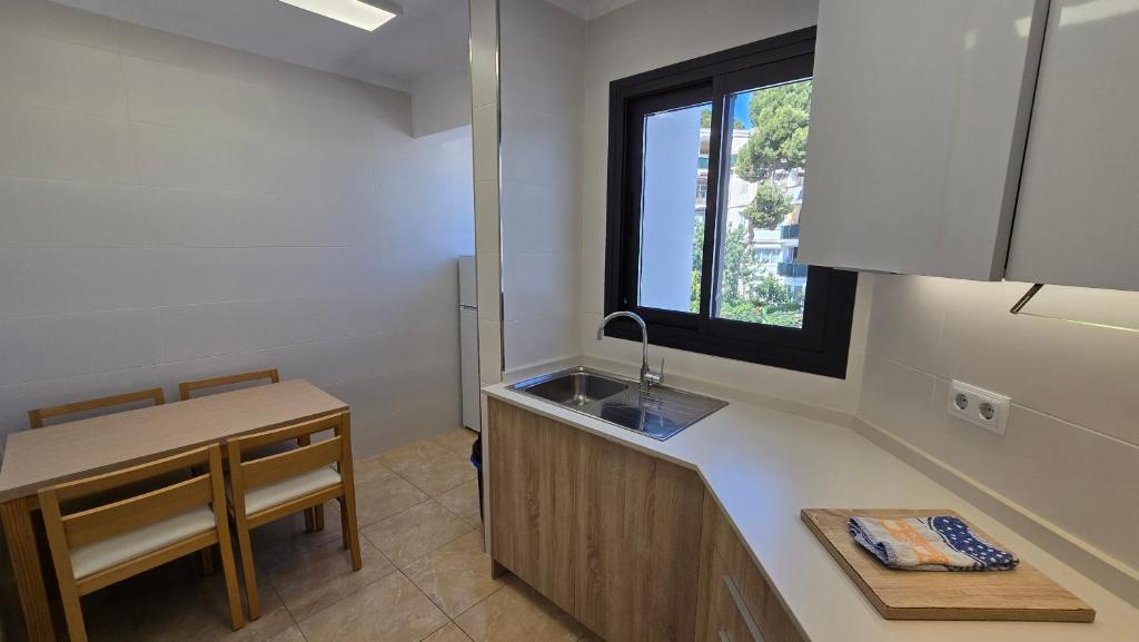 TV a/nebo společenská místnost v ubytování Marina Palmanova Apartamentos