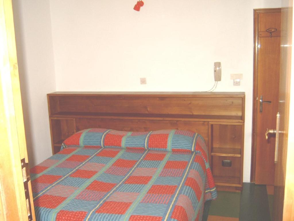 Postel nebo postele na pokoji v ubytování Albergo Tirolo