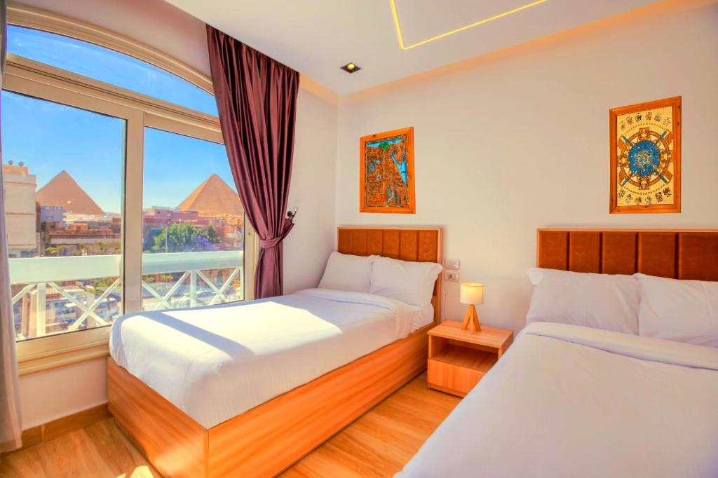 Postel nebo postele na pokoji v ubytování The diamond pyramids hotel