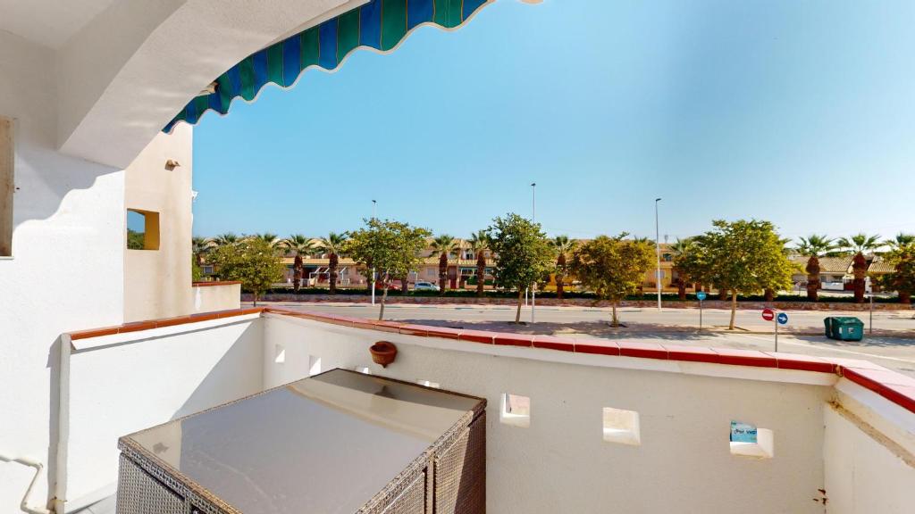 a balcony with a view of a parking lot at Holidoo Travel Casa Dorada in Los Alcázares