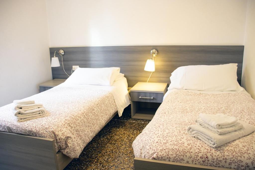 Postel nebo postele na pokoji v ubytování ALBERGO LOCANDA DIANA