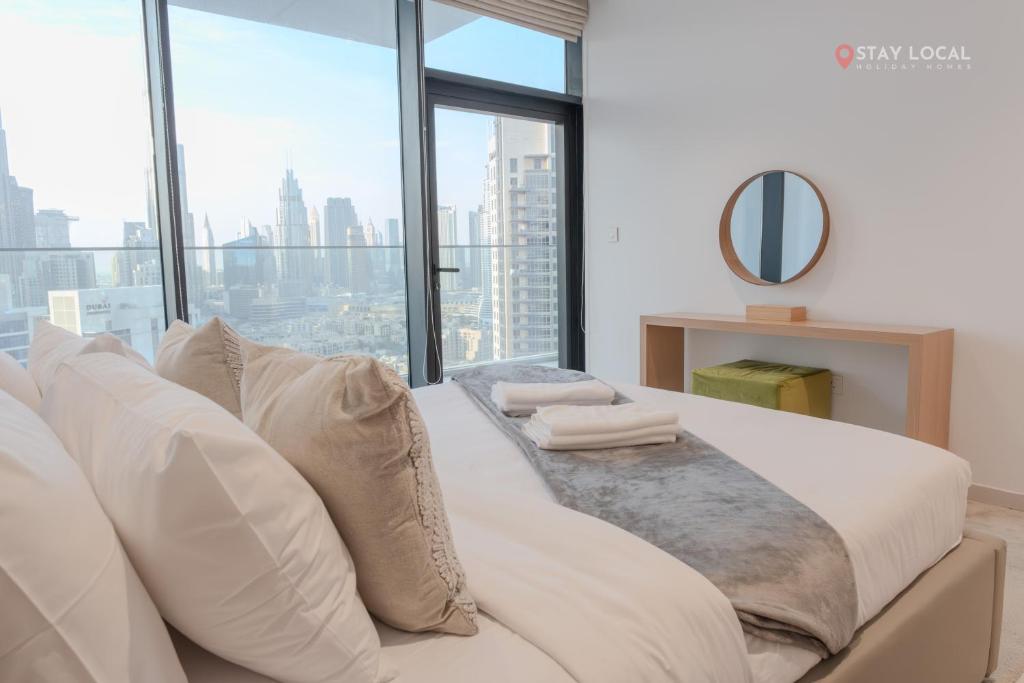 Posezení v ubytování Downtown Dreams I Cozy 2BR Getaway I Iconic Full Burj Khalifa Views I Near Dubai Mall