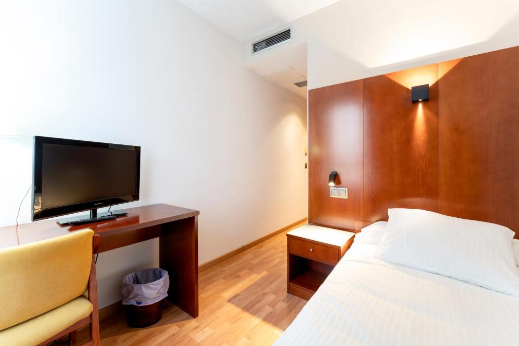 Postel nebo postele na pokoji v ubytování Hotel Doña Urraca