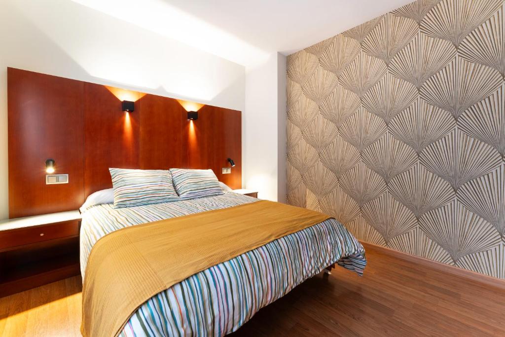 Postel nebo postele na pokoji v ubytování Hotel Doña Urraca