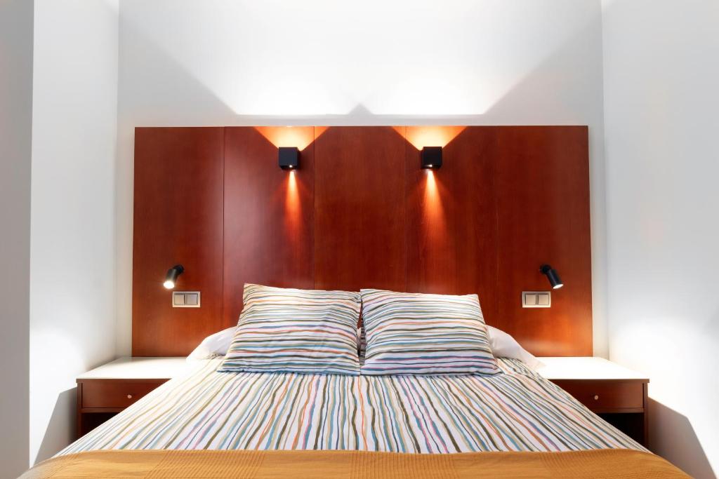 Postel nebo postele na pokoji v ubytování Hotel Doña Urraca