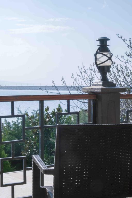 a street light sitting on top of a bench at Phellos Suites Boutique Hotel in Şile