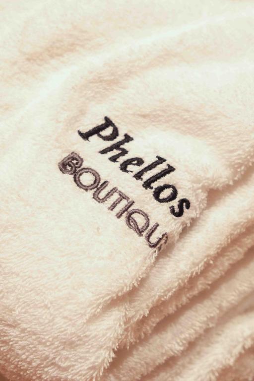 a white blanket with the word picnic online written on it at Phellos Suites Boutique Hotel in Şile