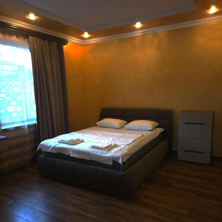 Postel nebo postele na pokoji v ubytování Alpha Rest House