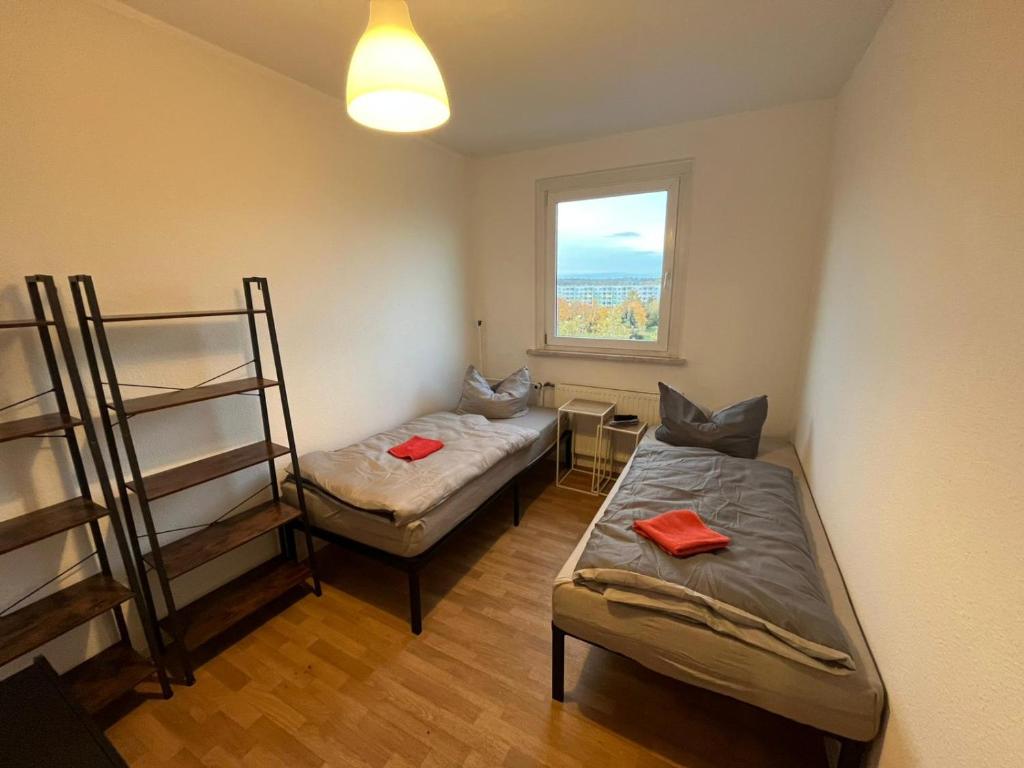 a room with two bunk beds and a window at 13 Apartments 3BR R&P Living in Halle an der Saale