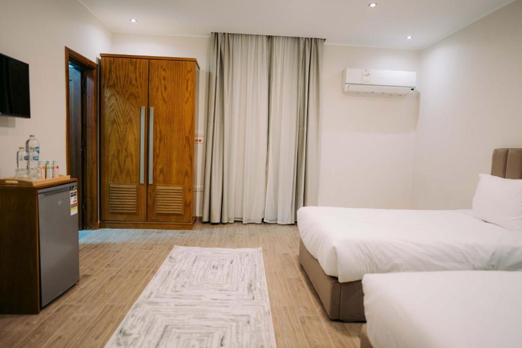 Postel nebo postele na pokoji v ubytování Florya pyramids Palace