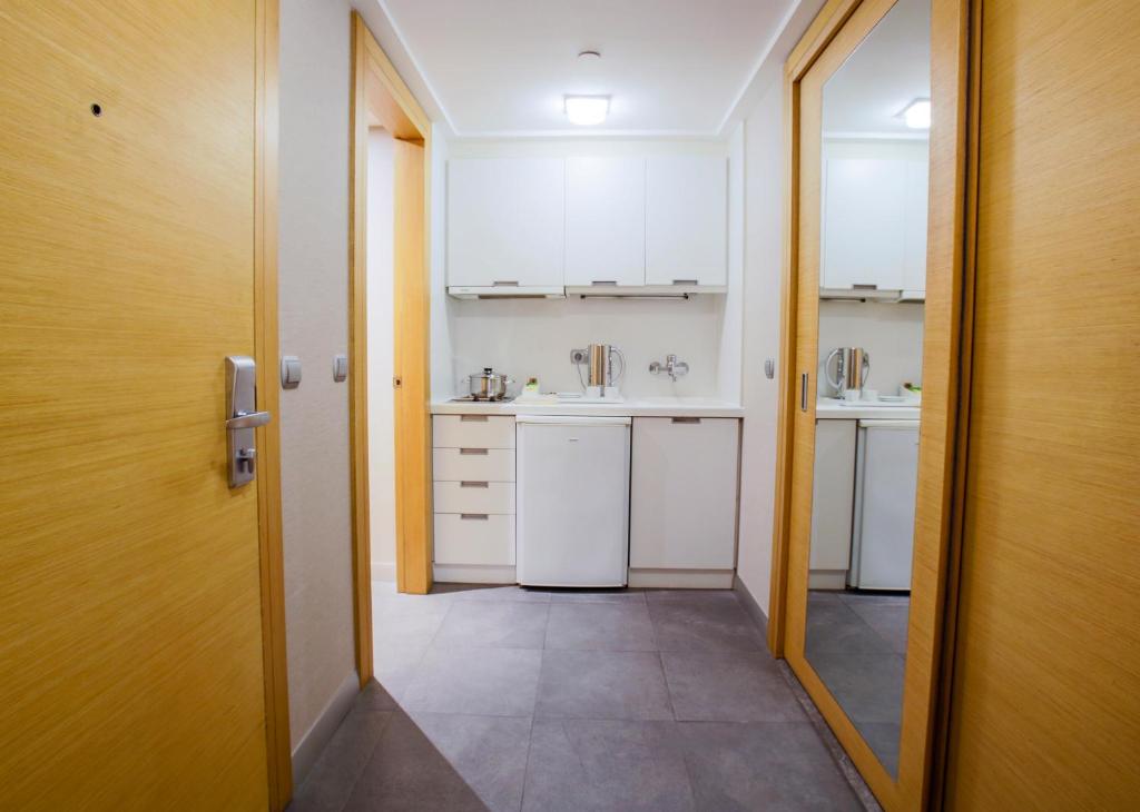 Kuchyň nebo kuchyňský kout v ubytování Housez Suites & Apartments Special Class
