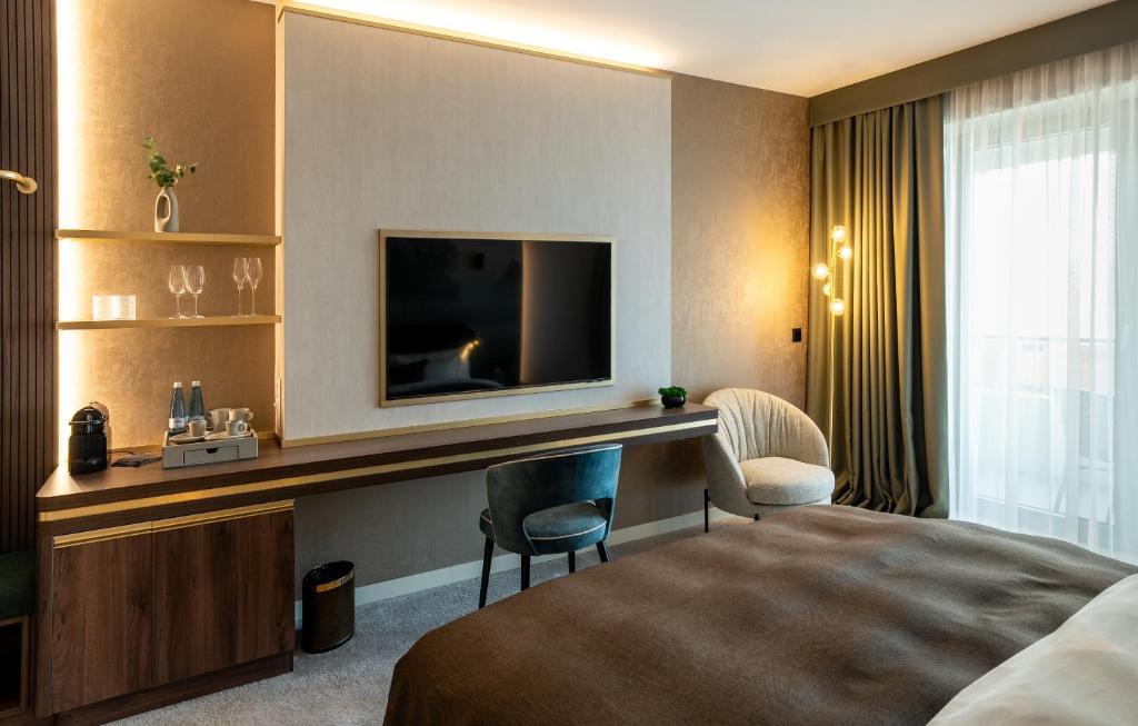 TV a/nebo společenská místnost v ubytování Le Primore Hotel & Spa