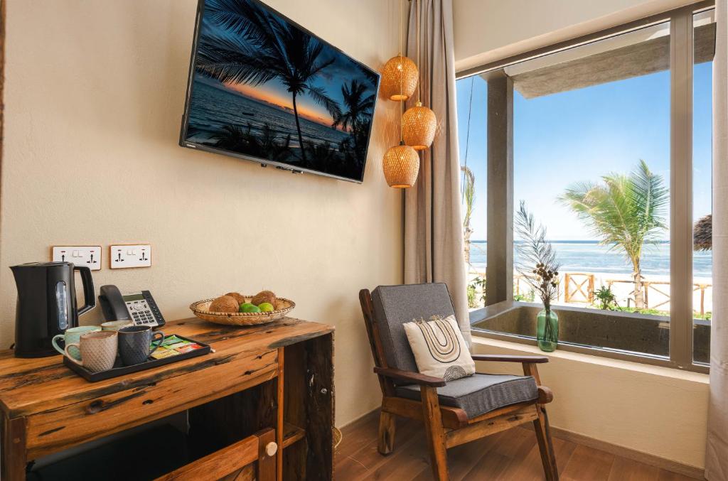 TV a/nebo společenská místnost v ubytování Clove Island Essence & Spa