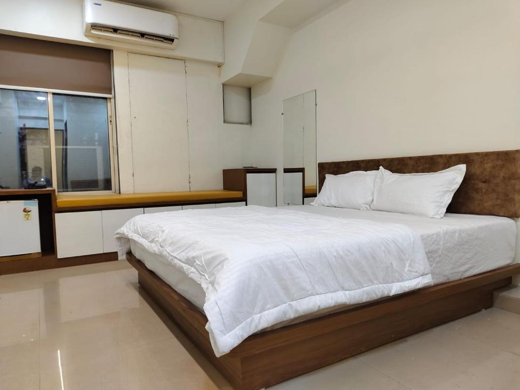 Postel nebo postele na pokoji v ubytování Hotel Spark Inn