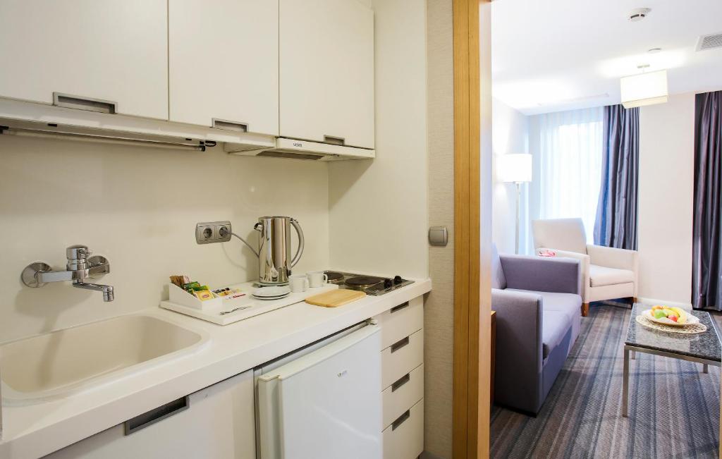 Kuchyň nebo kuchyňský kout v ubytování Housez Suites & Apartments Special Class