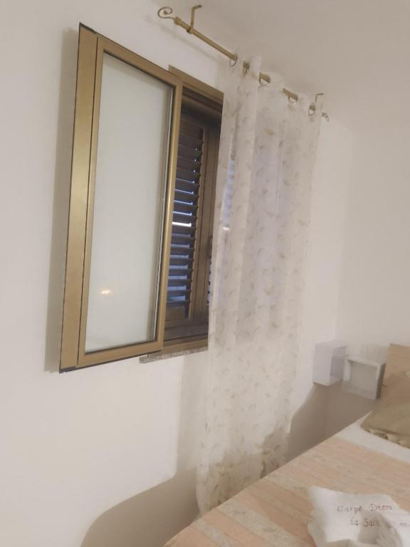 Postel nebo postele na pokoji v ubytování Carpe Diem da Salvina