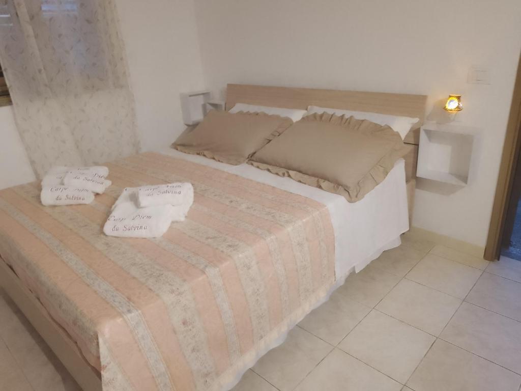Postel nebo postele na pokoji v ubytování Carpe Diem da Salvina