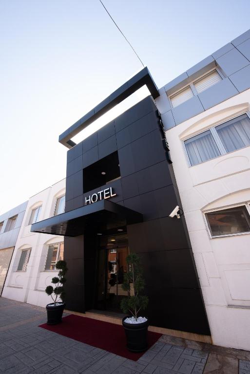 a building with a hotel sign on it at Hotel Sun Loznica in Loznica