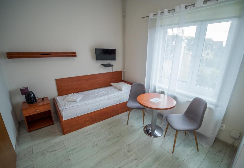 Postel nebo postele na pokoji v ubytování Meduza ośrodek wczasowy