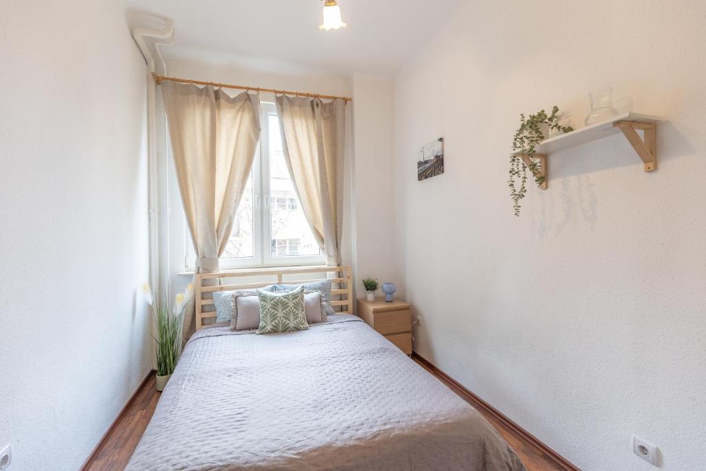 Posteľ alebo postele v izbe v ubytovaní Riverside Balcony Apartment with view to Danube