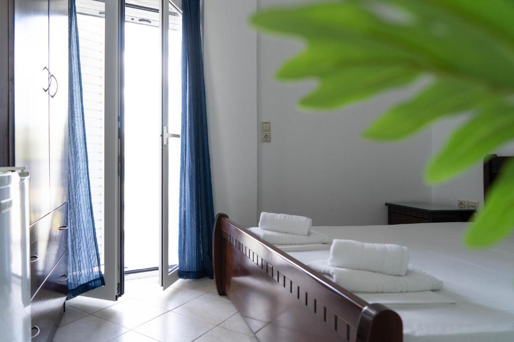 Postel nebo postele na pokoji v ubytování Hotel Alexandros