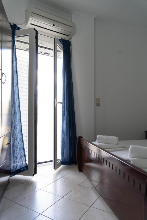 Postel nebo postele na pokoji v ubytování Hotel Alexandros