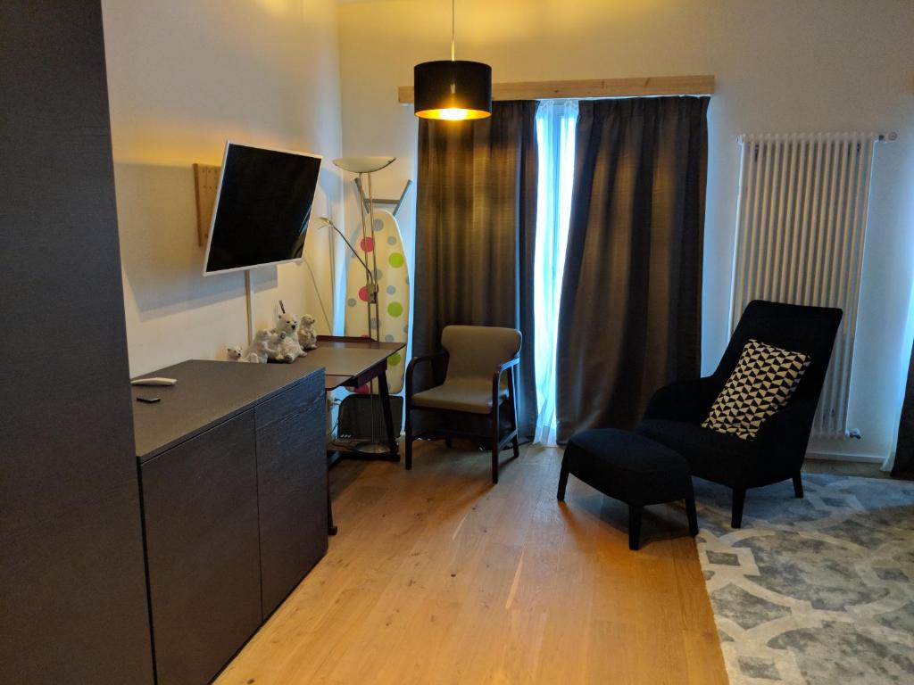 TV a/nebo společenská místnost v ubytování Hotel Lakeview bei Interlaken