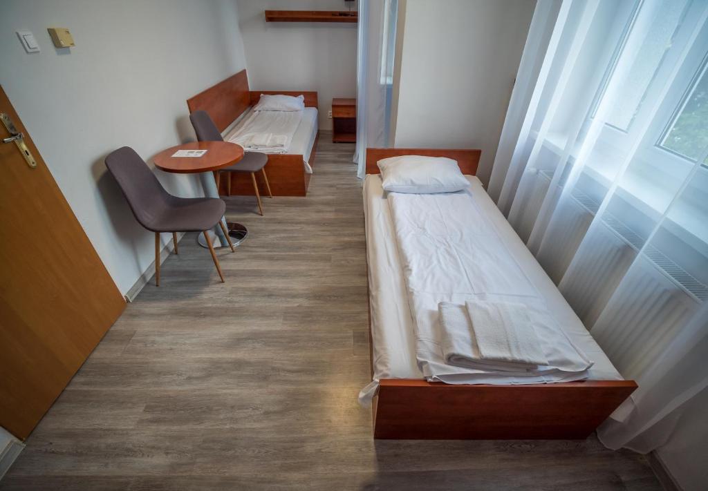 Postel nebo postele na pokoji v ubytování Meduza ośrodek wczasowy