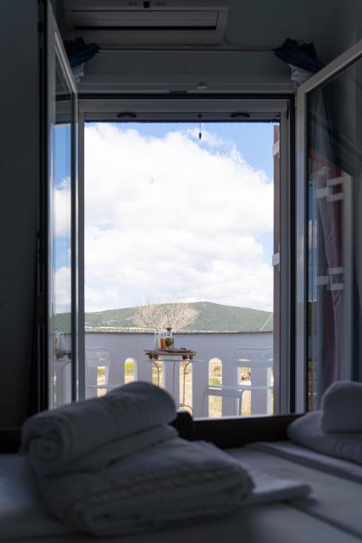 Postel nebo postele na pokoji v ubytování Hotel Alexandros
